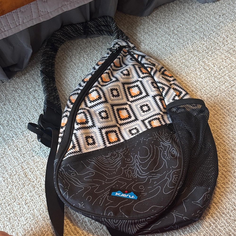 Kavu Geo Pattern Sling Backpack in Black, Cream and Orange